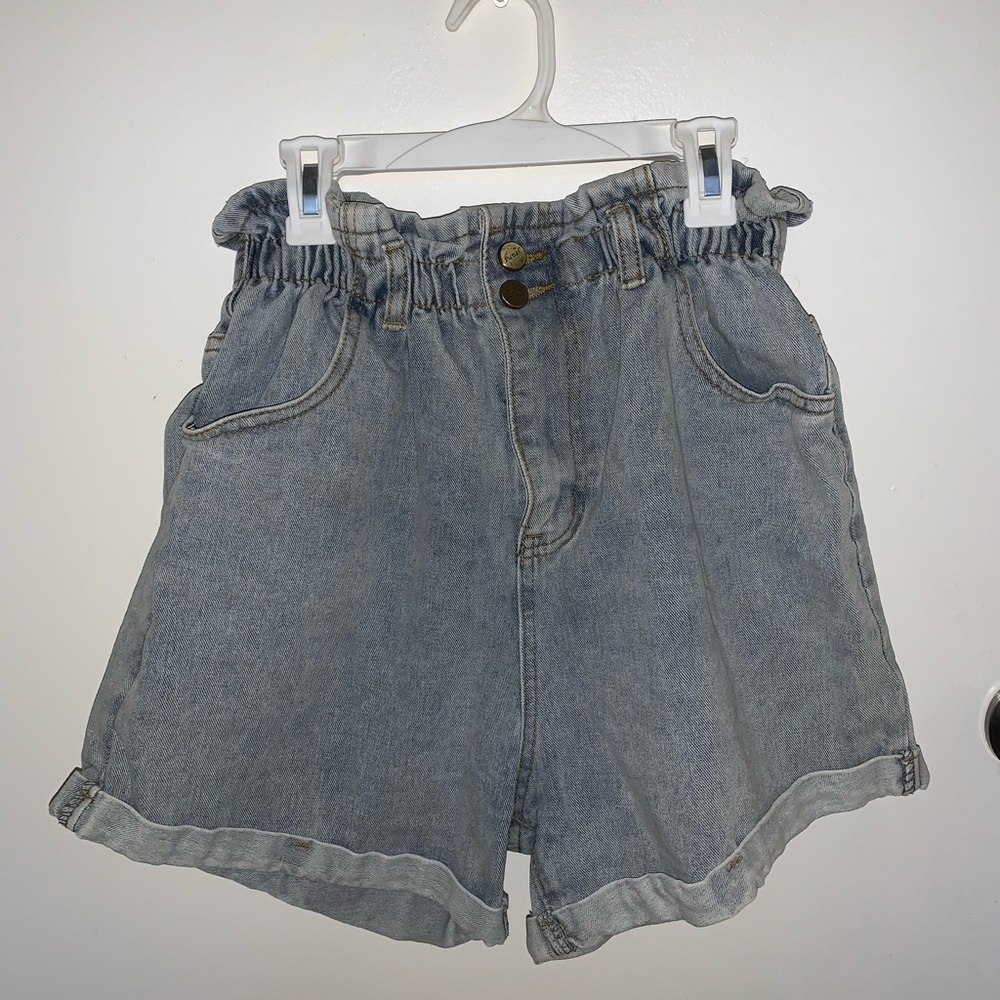 Plaid and plain denim paper bag shorts.